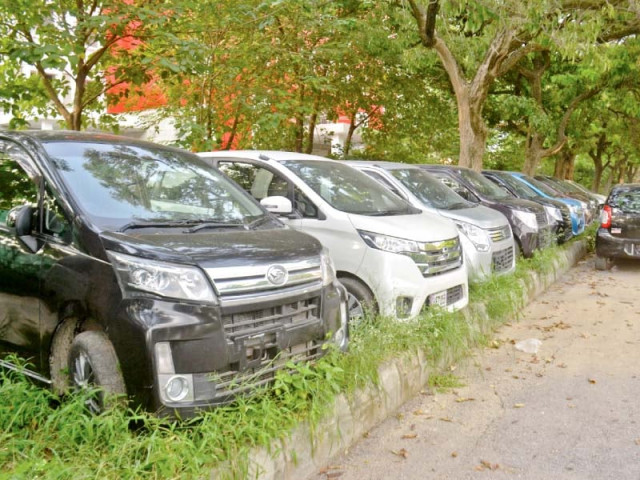 cars are parked on a section of the greenbelt by showroom owners in union council 32 in sector g 8 photo waseem nazir express cars are parked on a section of the greenbelt by showroom owners in union council 32 in sector g 8 photo waseem nazir express