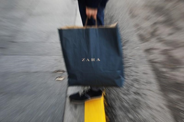 a mans hold a zara shopping bag outside a zara store an inditex brand in central madrid spain december 13 2017 photo reuters