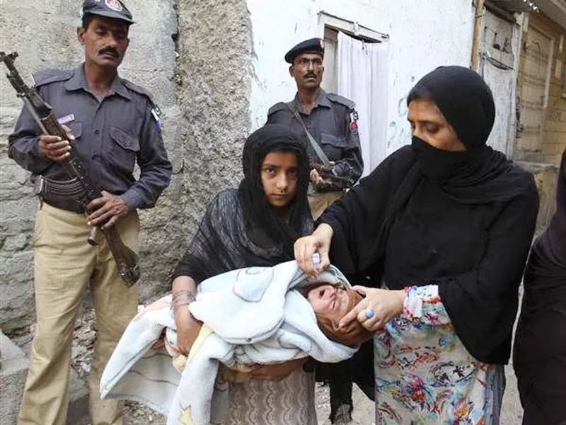 a health worker administers polio vaccination photo file a health worker administers polio vaccination photo file