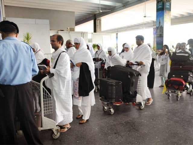 the quetta bound pilgrims held a seven hour long sit in at the airport against the negligence of airport officials photo express file