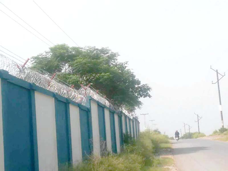 power lines pass over the boundary wall of a school in bani gala photo express