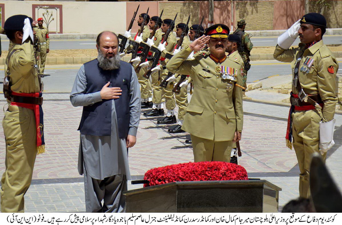 balochistan chief minister jam kamal khan and commander southern command lt gen asim saleem bajwa pay their respects at the yadgar e shuhada photo nni