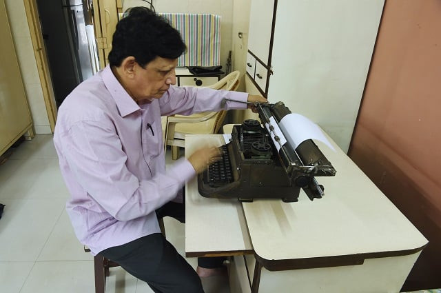 indian artist chandrakant bhide works on his typewriters photo afp indian artist chandrakant bhide works on his typewriters photo afp