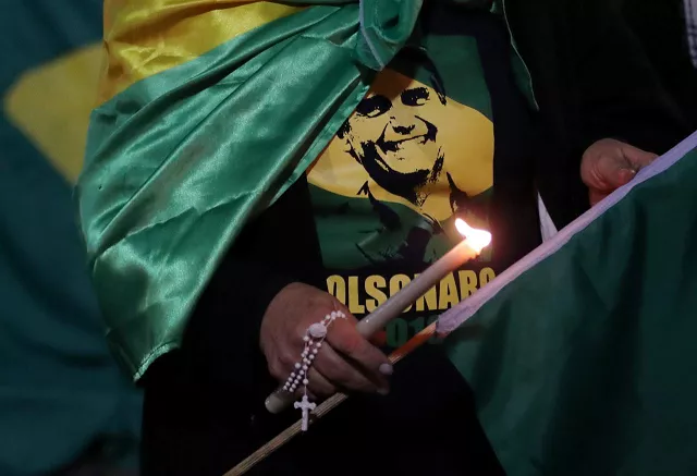 a woman lights a candle for presidential candidate jair bolsonaro after he was stabbed by a man in juiz de fora at paulista avenue in sao paulo brazil september 6 2018 photo reuters a woman lights a candle for presidential candidate jair bolsonaro after he was stabbed by a man in juiz de fora at paulista avenue in sao paulo brazil september 6 2018 photo reuters