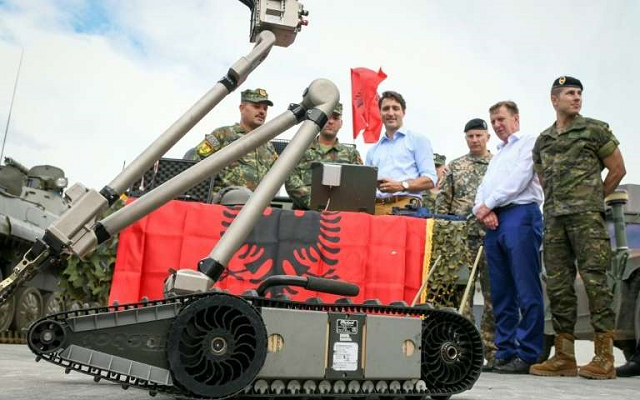 canadian prime minister justin trudeau center inspects a military robot deployed with nato troops in latvia in july 2018 photo afp canadian prime minister justin trudeau center inspects a military robot deployed with nato troops in latvia in july 2018 photo afp