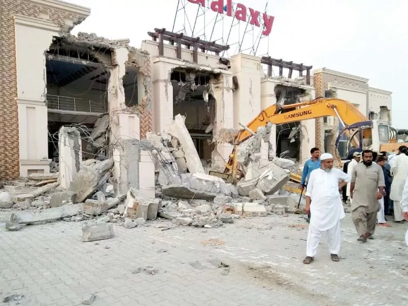 cda staff use excavator to tear down an illegal building in sector i 11 photo waseem nazir express cda staff use excavator to tear down an illegal building in sector i 11 photo waseem nazir express