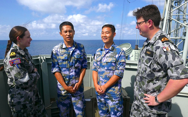 royal australian navy sailors stand with officers from the chinese navy aboard hmas newcastle during australia s largest maritime exercise exercise kakadu being conducted off the coast of darwin september 8 2018 photo reuters royal australian navy sailors stand with officers from the chinese navy aboard hmas newcastle during australia s largest maritime exercise exercise kakadu being conducted off the coast of darwin september 8 2018 photo reuters