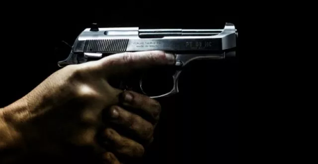 a man holds a gun at the calibre 12 shooting club in rio de janeiro photo afp a man holds a gun at the calibre 12 shooting club in rio de janeiro photo afp