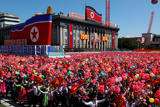 people wave plastic flowers and balloons during a military parade marking the 70th anniversary of north korea 039 s foundation in pyongyang photo reuters