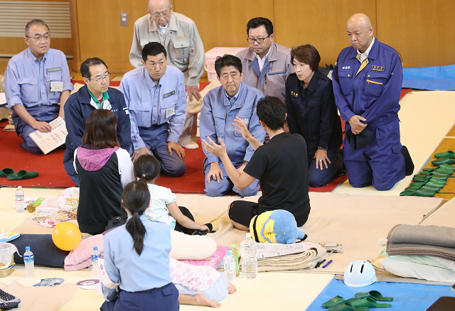 japanese prime minister shinzo abe talks to survivors in a shelter of the devastated city of atsuma photo afp japanese prime minister shinzo abe talks to survivors in a shelter of the devastated city of atsuma photo afp