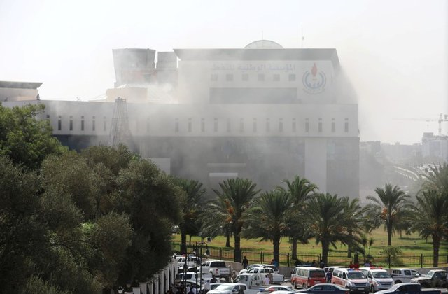 smoke rises form the headquarters of libyan state oil firm national oil corporation noc after three masked persons attacked it in tripoli libya september 10 2018 photo reuters