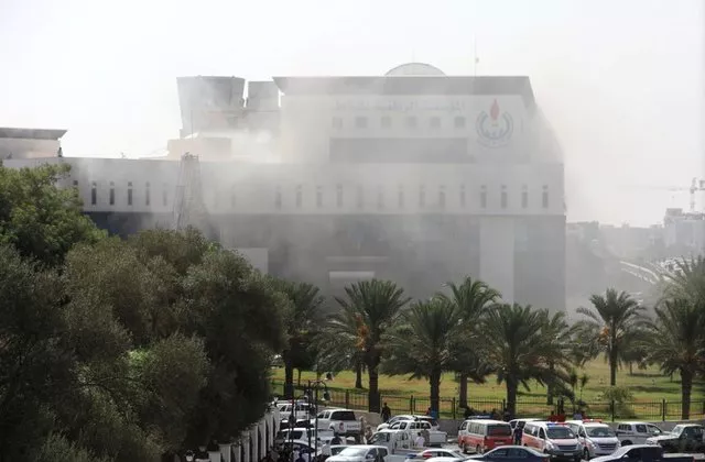smoke rises form the headquarters of libyan state oil firm national oil corporation noc after three masked persons attacked it in tripoli libya september 10 2018 photo reuters smoke rises form the headquarters of libyan state oil firm national oil corporation noc after three masked persons attacked it in tripoli libya september 10 2018 photo reuters
