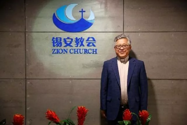 the head pastor of the zion church in beijing jin mingri poses for pictures in the lobby of the unofficial protestant quot house quot church in beijing photo reuters file the head pastor of the zion church in beijing jin mingri poses for pictures in the lobby of the unofficial protestant quot house quot church in beijing photo reuters file
