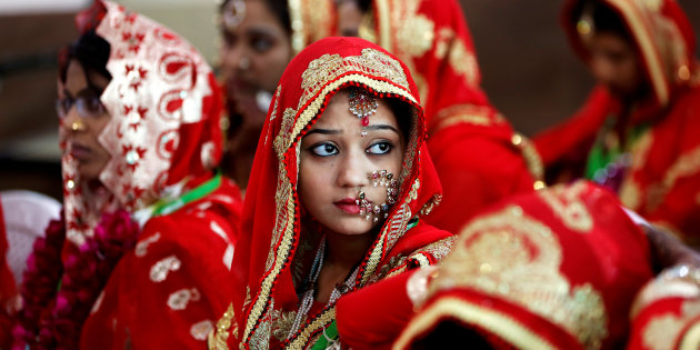 brides sit and wait for their turn during a muslim mass wedding in ahmedabad india photo reuters