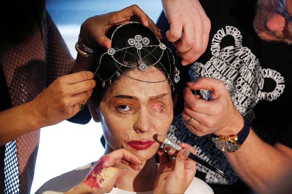 Indian model and acid attack survivor Reshma Quereshi has make up applied before walking to present Indian designer Archana Kochhar's Spring/Summer 2017 collections during New York Fashion Week in the Manhattan borough of New York. PHOTO: REUTERS