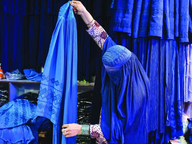 the blue burqa has become a symbol of taliban oppression photo afp the blue burqa has become a symbol of taliban oppression photo afp