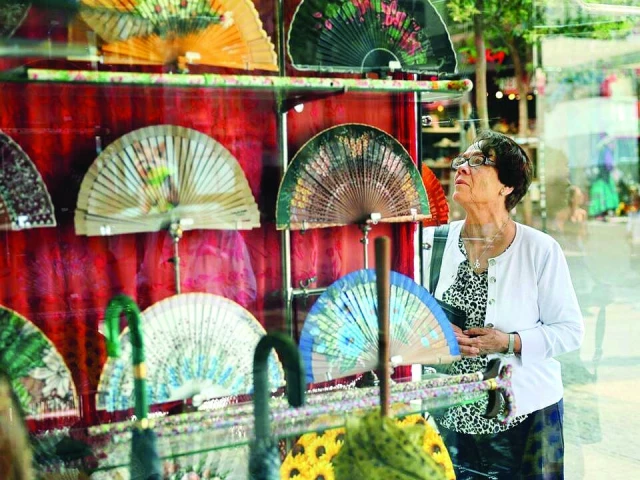 fans of fans say the items are a necessity in the heat photo afp