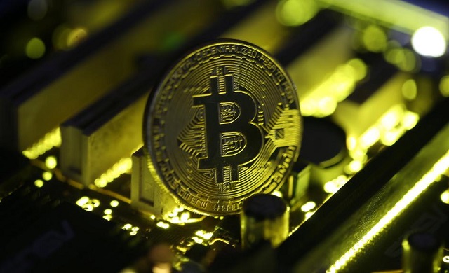 a copy of bitcoin standing on pc motherboard is seen in this illustration picture october 26 2017 photo reuters