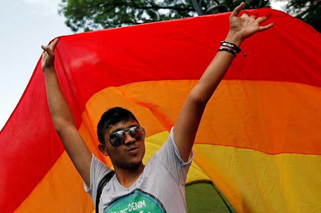 a member of romania 039 s gay community takes part in the gay fest 2014 pride parade in bucharest romania photo reuters file