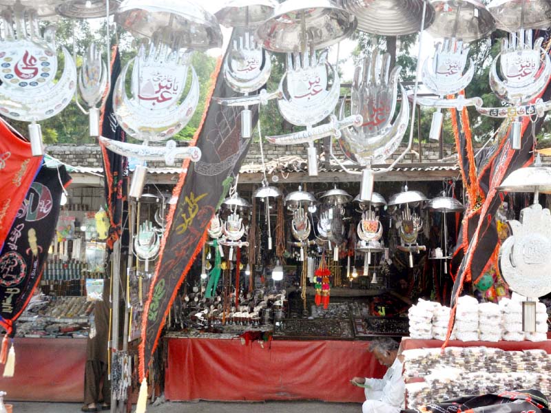 muharram related items on sale at a stall in islamabad photo agha mehroz express