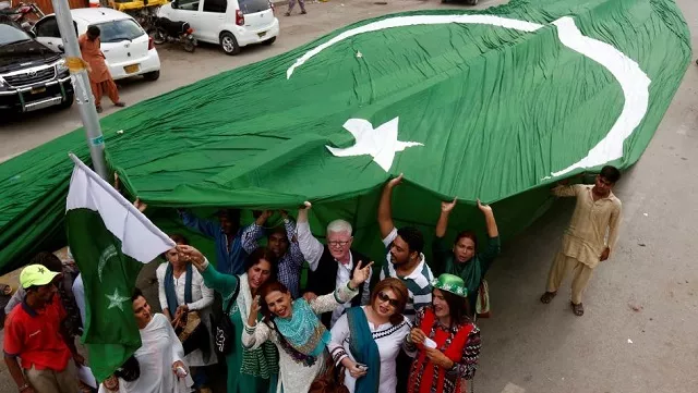 supporters of civil rights group for transgender people the gender interactive alliance gia dance and chant slogans as they pose with a national flag in karachi august 2016 photo reuters supporters of civil rights group for transgender people the gender interactive alliance gia dance and chant slogans as they pose with a national flag in karachi august 2016 photo reuters