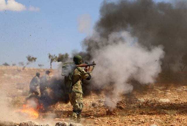 a rebel fighter from the turkish backed national liberation front takes part in combat training in syria 039 s last major rebel bastion idlib on september 11 2018 in anticipation of a russian backed government offensive photo afp