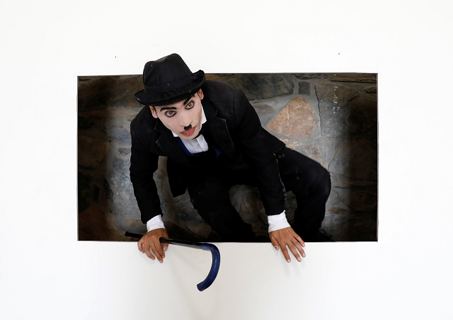 afghanistan 039 s charlie chaplin karim asir 25 exercises during his rehearsals photo reuters afghanistan 039 s charlie chaplin karim asir 25 exercises during his rehearsals photo reuters