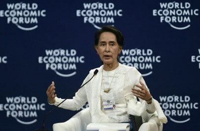 suu kyi defends court decision to jail reuters reporters