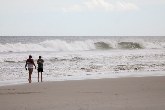 hurricane florence was downgraded to a category 3 storm on wednesday as peak winds eased to 125 miles per hour photo afp