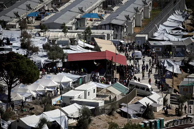 refugees and migrants line up for food distribution at the moria migrant camp on the island of lesbos greece october 6 2016 photo reuters refugees and migrants line up for food distribution at the moria migrant camp on the island of lesbos greece october 6 2016 photo reuters