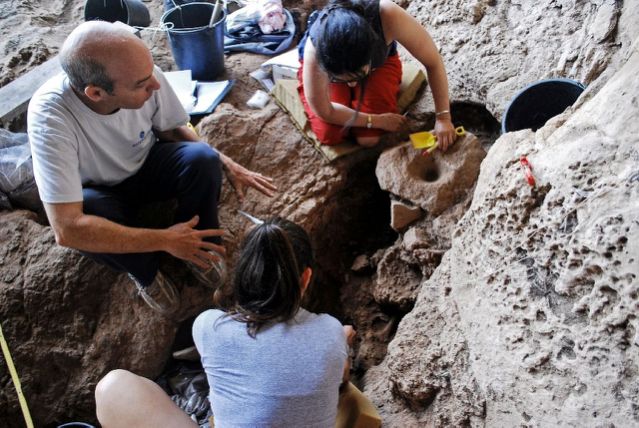 archaeologists inspect what they believe is the world 039 s oldest site for alcohol production south of the israeli city of haifa in cave dating back 13 000 years   photo afp