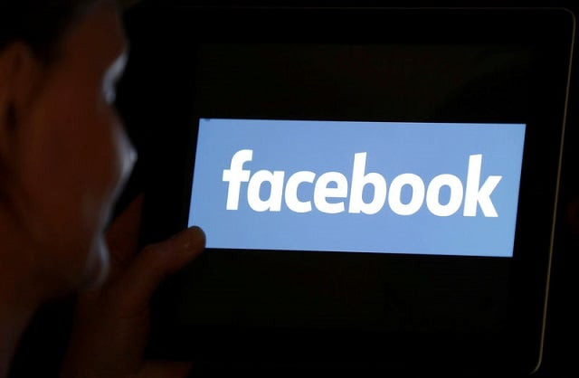 a woman looks at the facebook logo on an ipad in this photo illustration taken june 3 2018 photo reuters a woman looks at the facebook logo on an ipad in this photo illustration taken june 3 2018 photo reuters