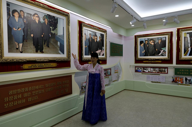 a guide gives foreign reporters a tour of an exhibition to commemorate visits by north korean leaders kim jng il and kim jong un to a cosmetic factory in pyongyang north korea september 8 2018 picture taken september 8 2018 photo reuters