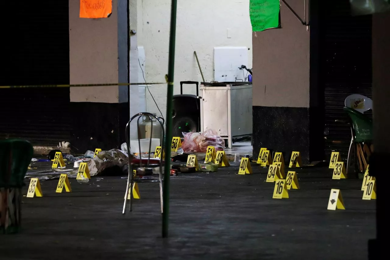 evidence markers are seen at a crime scene where three men were gunned down by unknown assailants at an intersection on the edge of tourist plaza garibaldi in mexico city mexico photo reuters evidence markers are seen at a crime scene where three men were gunned down by unknown assailants at an intersection on the edge of tourist plaza garibaldi in mexico city mexico photo reuters