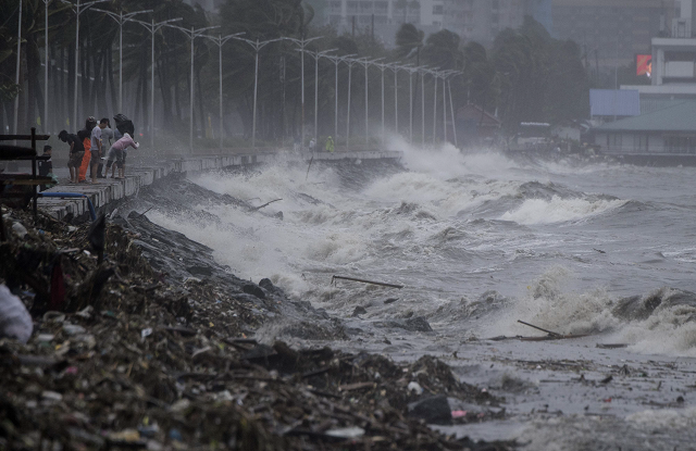 strong waves caused by super typhoon mangkhut are seen in manila on september 15 2018   super typhoon mangkhut slammed into the northern philippines with violent winds and torrential rains as authorities warned millions in its path of potentially heavy destruction photo afp