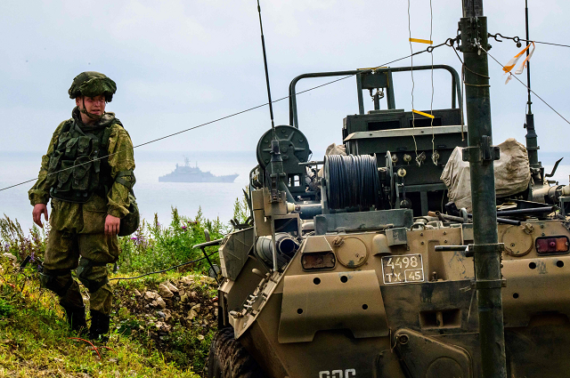 a russian officer looks on during the vostok 2018 east 2018 military drills at klerka training ground on the sea of japan coast photo afp