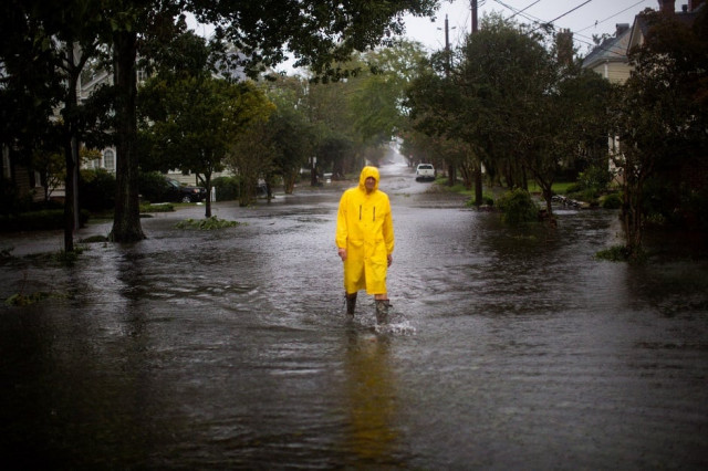 a man walks through flooded streets during the passing of hurricane florence in the town of new bern photo afp a man walks through flooded streets during the passing of hurricane florence in the town of new bern photo afp