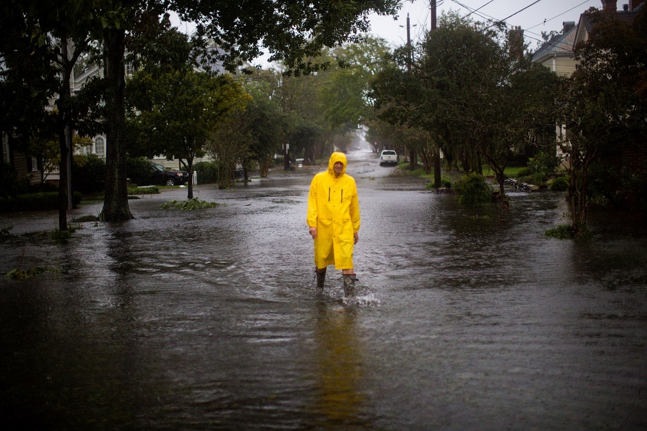 a man walks through flooded streets during the passing of hurricane florence in the town of new bern photo afp