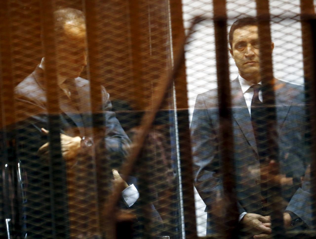 gamal l and alaa mubarak sons of egypt 039 s former president hosni mubarak react behind bars during their trial with their father not pictured inside a dock at the police academy on the outskirts of cairo may 9 2015 photo reuters