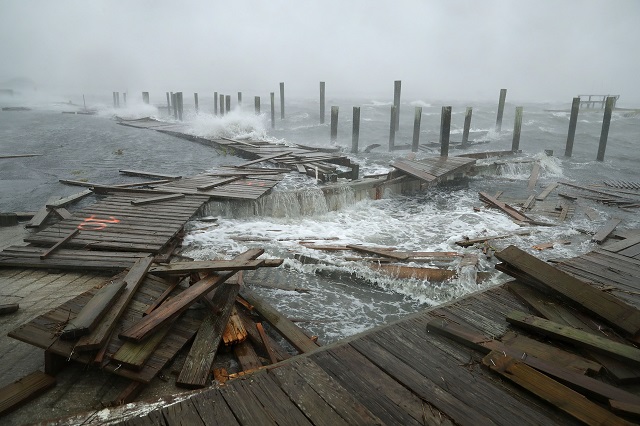 portions of a boat dock and boardwalk are destroyed by powerful wind and waves as hurricane florence arrives photo afp