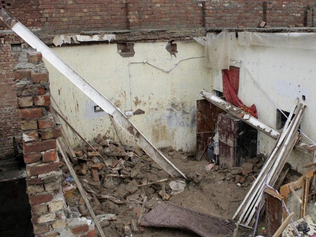 residents rushed to the scene and recovered the bodies and injured child from under the rubble photo express file residents rushed to the scene and recovered the bodies and injured child from under the rubble photo express file
