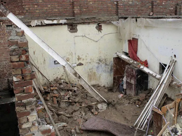 residents rushed to the scene and recovered the bodies and injured child from under the rubble photo express file residents rushed to the scene and recovered the bodies and injured child from under the rubble photo express file