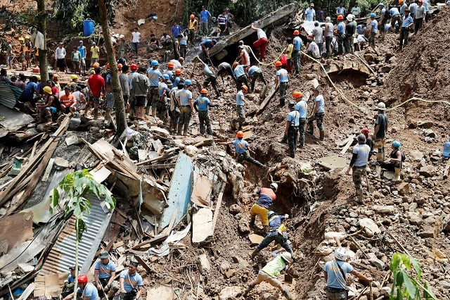rescuers search for people trapped in a landslide after super typhoon mangkhut hit the country at a mining camp in itogon benguet philippines september 17 2018 photo reuters rescuers search for people trapped in a landslide after super typhoon mangkhut hit the country at a mining camp in itogon benguet philippines september 17 2018 photo reuters