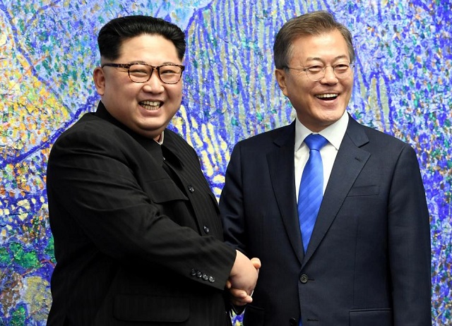 south korean president moon jae in shakes hands with north korean leader kim jong un during their meeting at the peace house photo reuters