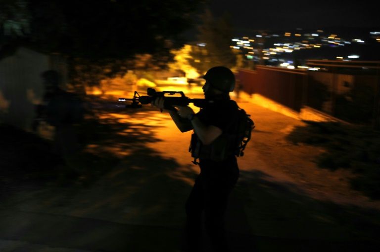 israeli forces seen here during a drill on august 13 2018 regularly stage overnight raids to arrest palestinians in the west bank photo afp