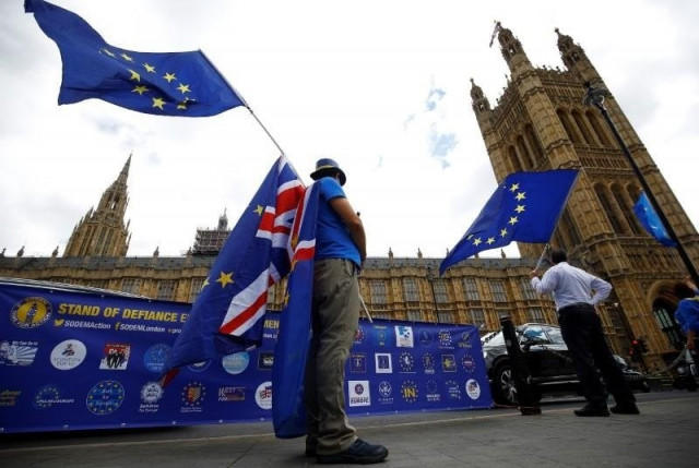 anti brexit demonstrators wave eu and union flags opposite the houses of parliament in london britain photo reuters anti brexit demonstrators wave eu and union flags opposite the houses of parliament in london britain photo reuters