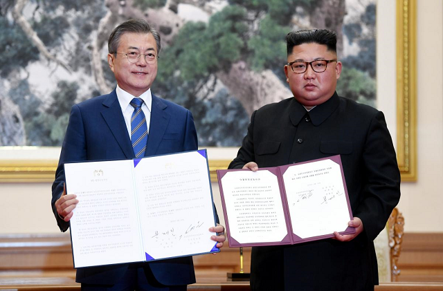 south korean president moon jae in and north korean leader kim jong un pose for photographs with the joint statement in pyongyang north korea september 19 2018 photo reuters south korean president moon jae in and north korean leader kim jong un pose for photographs with the joint statement in pyongyang north korea september 19 2018 photo reuters