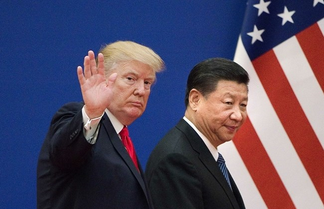 in this file photo taken on november 9 2017 shows us president donald trump l and china 039 s president xi jinping leaving a business leaders event at the great hall of the people in beijing photo afp