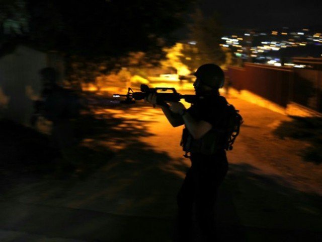 israeli forces seen here during a drill on august 13 2018 regularly stage overnight raids to arrest palestinians in the west bank photo afp