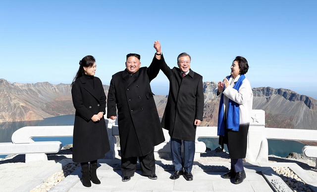 south korean president moon jae in and north korean leader kim jong un pose for photographs on the top of mt paektu north korea september 20 2018 photo reuters